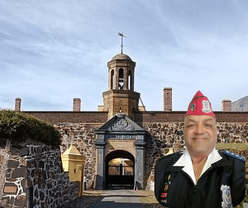 Ghanaian cadet group practicing military drills in school setting.